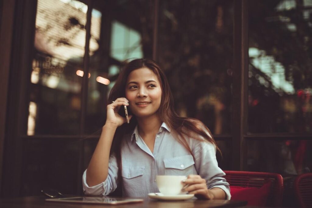 Woman in cafe talking on the phone